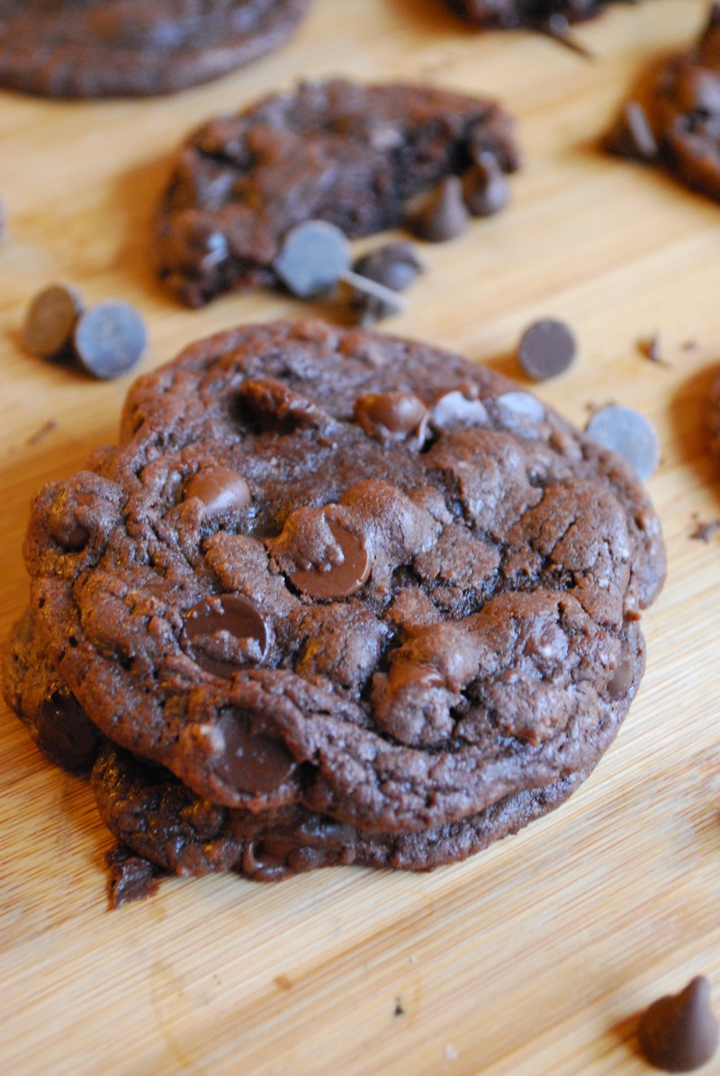 death by chocolate cookies on a wooden board with chocolate chips