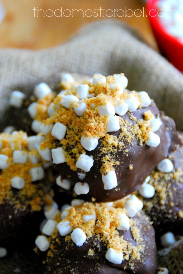 s'mores cookie dough brownie bombs stacked on a piece of burlap