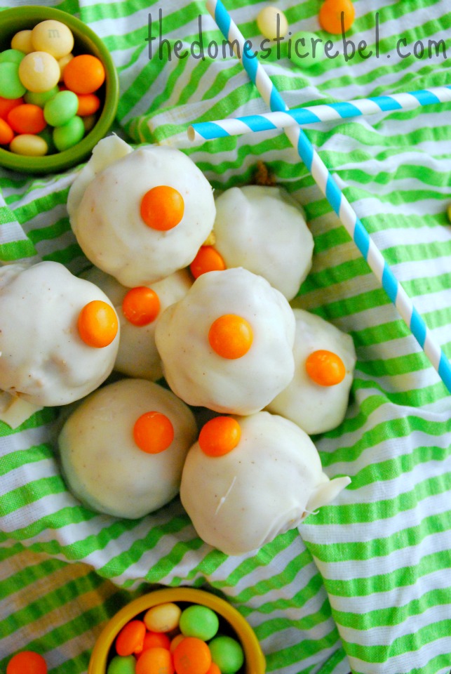 carrot cake cheesecake brownie bombs arranged in a pile on a green striped towel