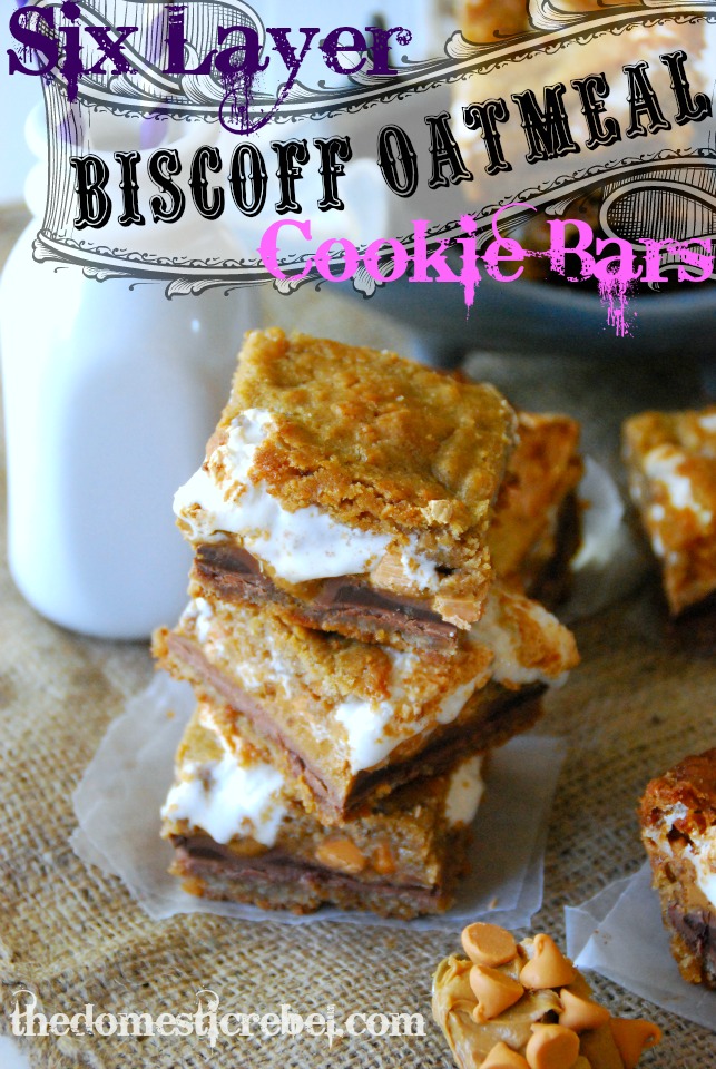six layer biscoff oatmeal cookie bars stacked on a burlap fabric