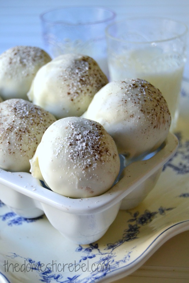 macaron brownie bombs arranged in a white dish with milk in background