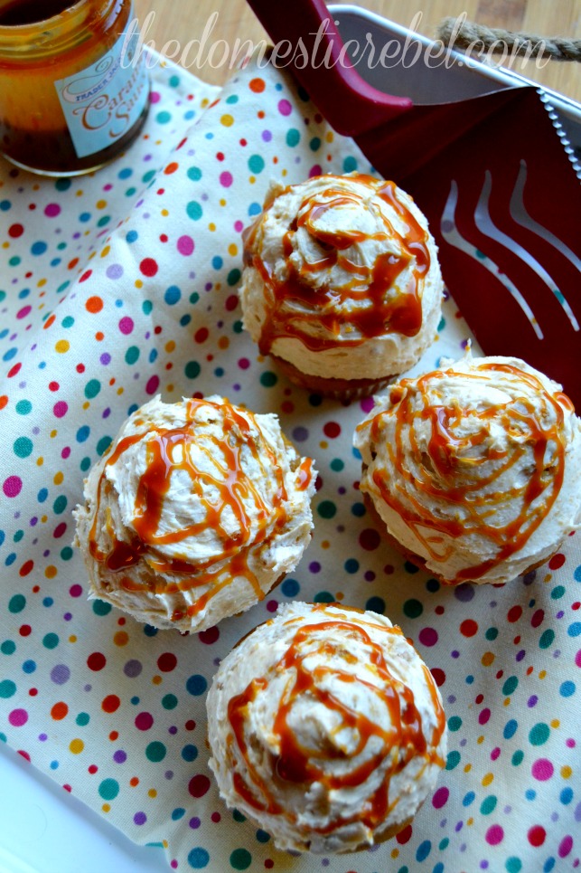 pumpkin cupcakes with pumpkin pie frosting arranged on a polka dot fabric