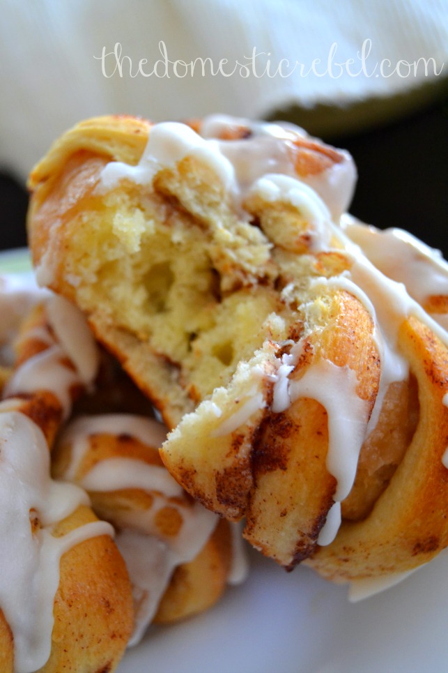 cinnamon roll-wrapped donuts closeup with bite removed