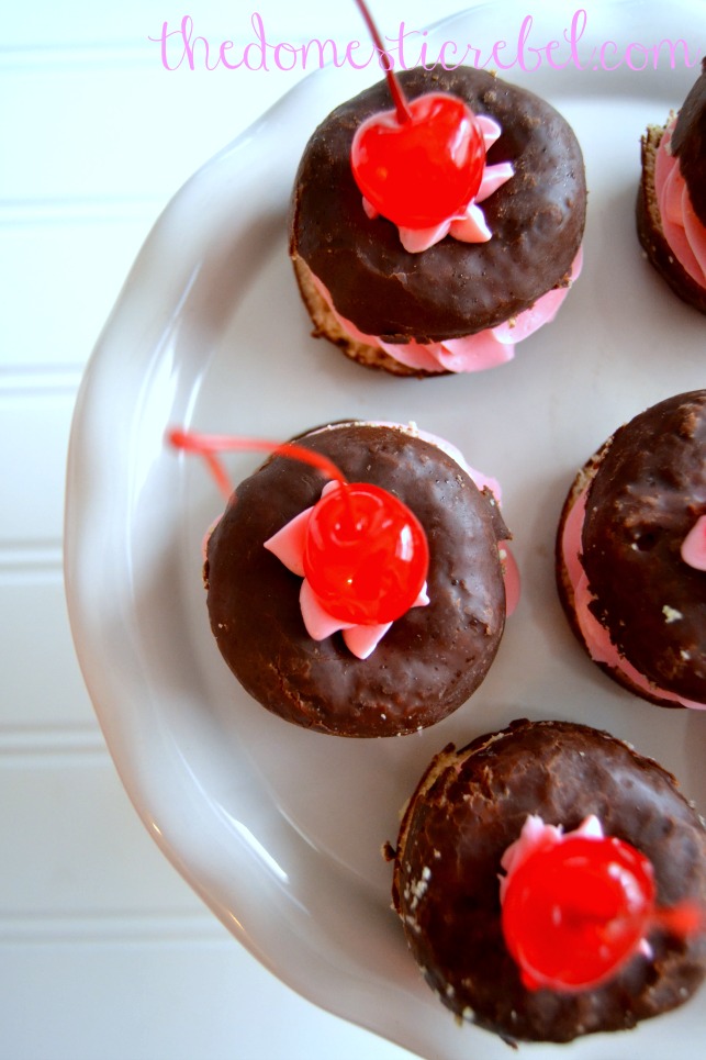 black forest donut whoopie pies arranged on white plate