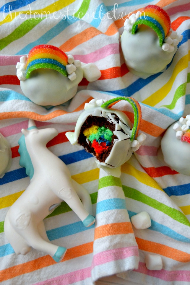 over the rainbow brownie bombs arranged on rainbow cloth with unicorn figurine