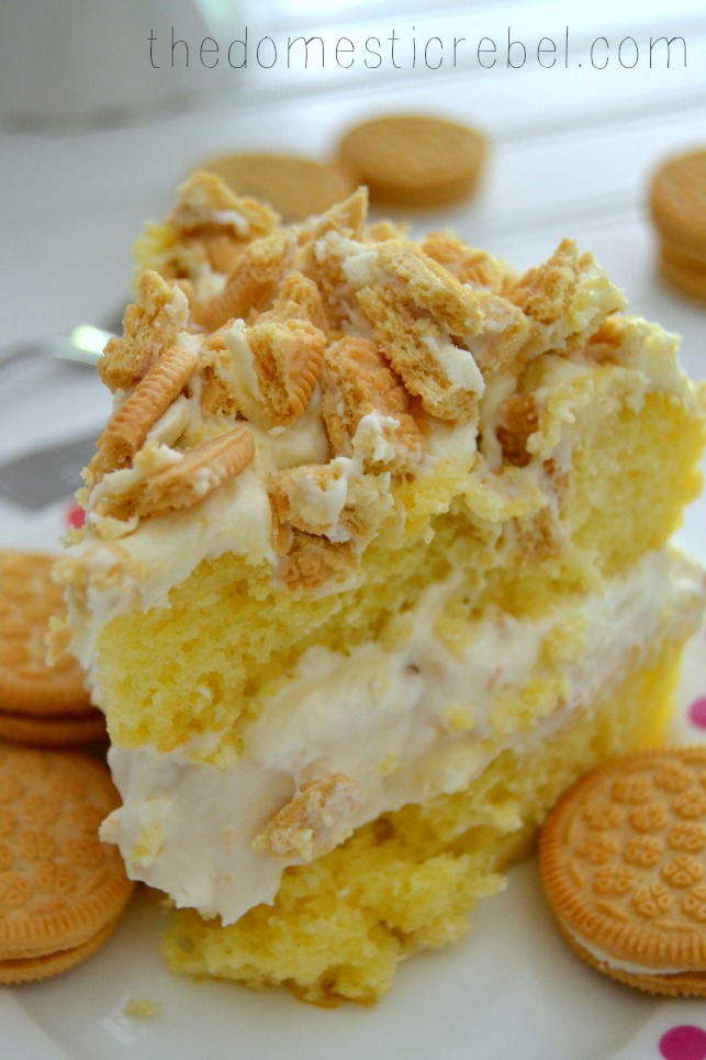 golden oreo overload cake slice on white plate