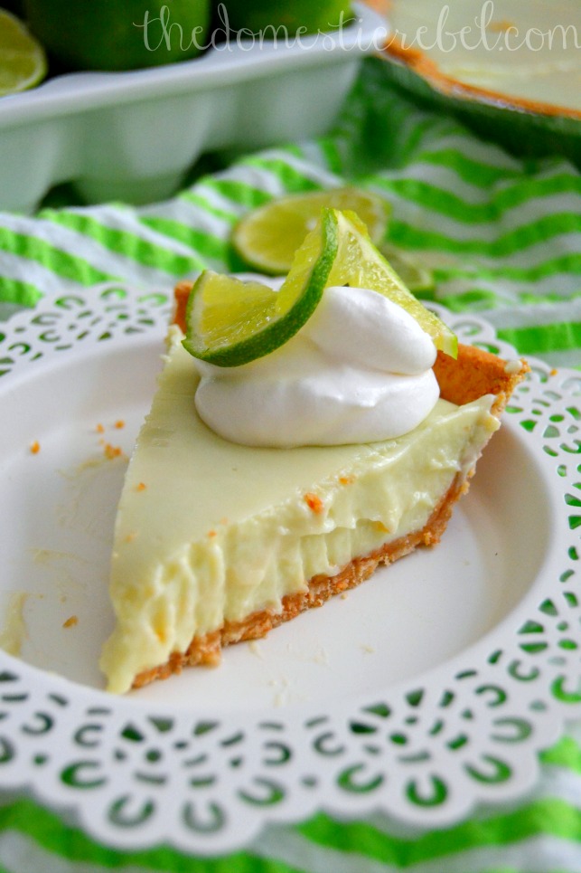 guiltless key lime pie slice on white plate and green background