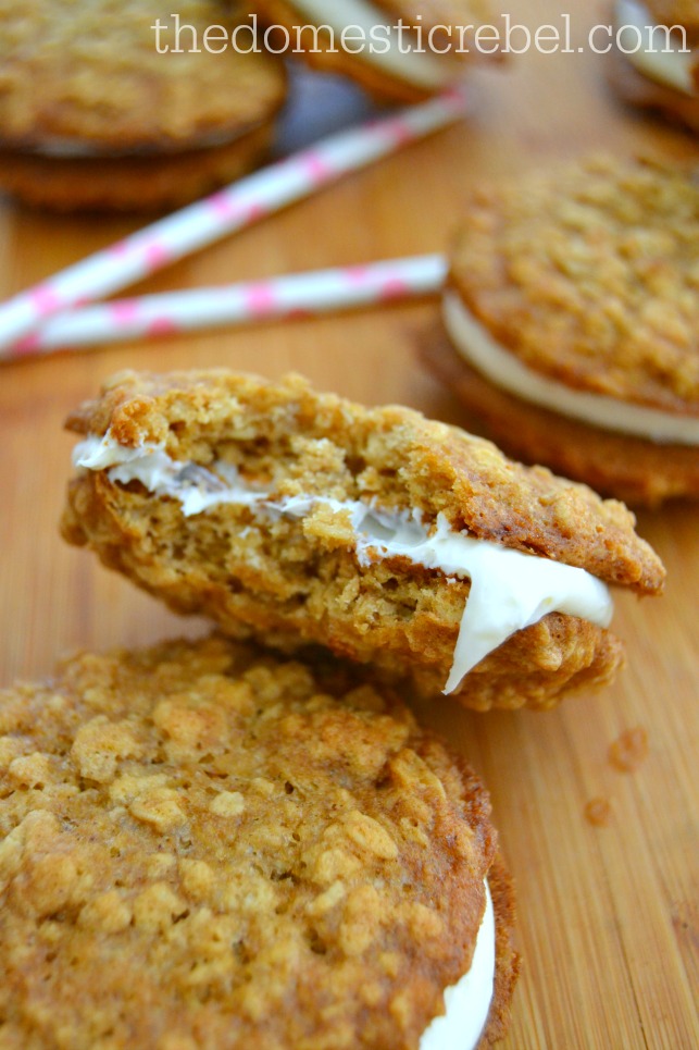copycat oatmeal creme pie with bite missing on wood background