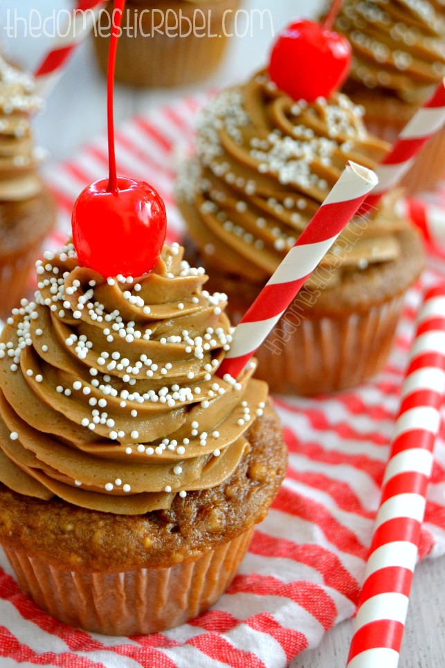 coke float cupcakes arranged in a line on a red and white fabric