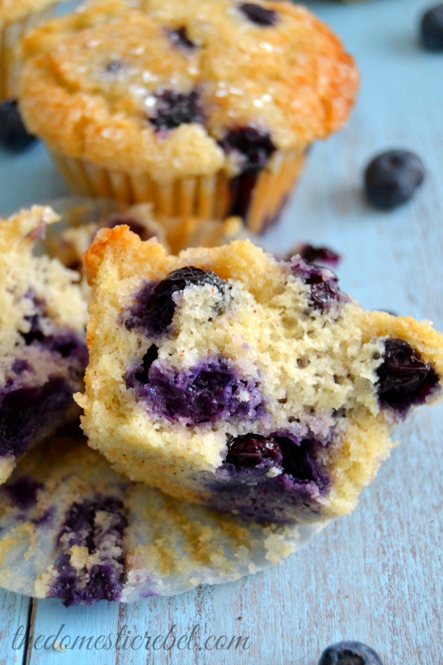 the best blueberry muffins cut open on blue background