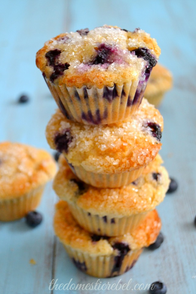 the best blueberry muffins stacked on blue background