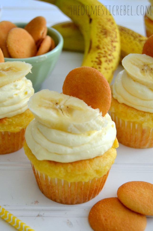 banana pudding cupcakes with cool whip pudding frosting on white background with bananas and cookies