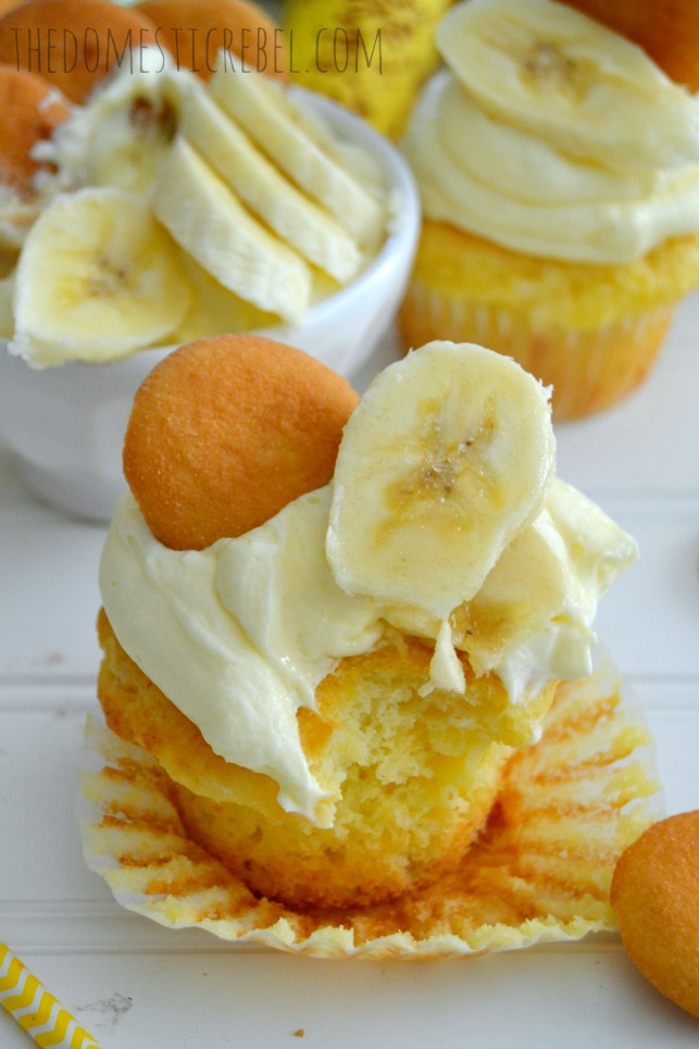 banana pudding cupcakes with cool whip pudding frosting with bite mark on white background