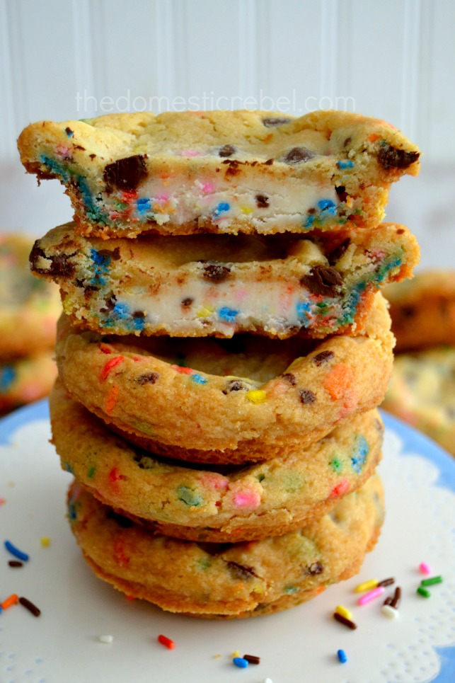 frosting filled deep dish cake batter cookies stacked on white plate
