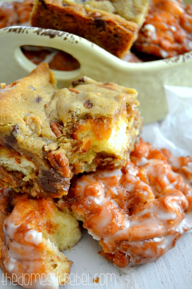 apple fritter turtle cookie bars sitting on apple fritters with dish in background