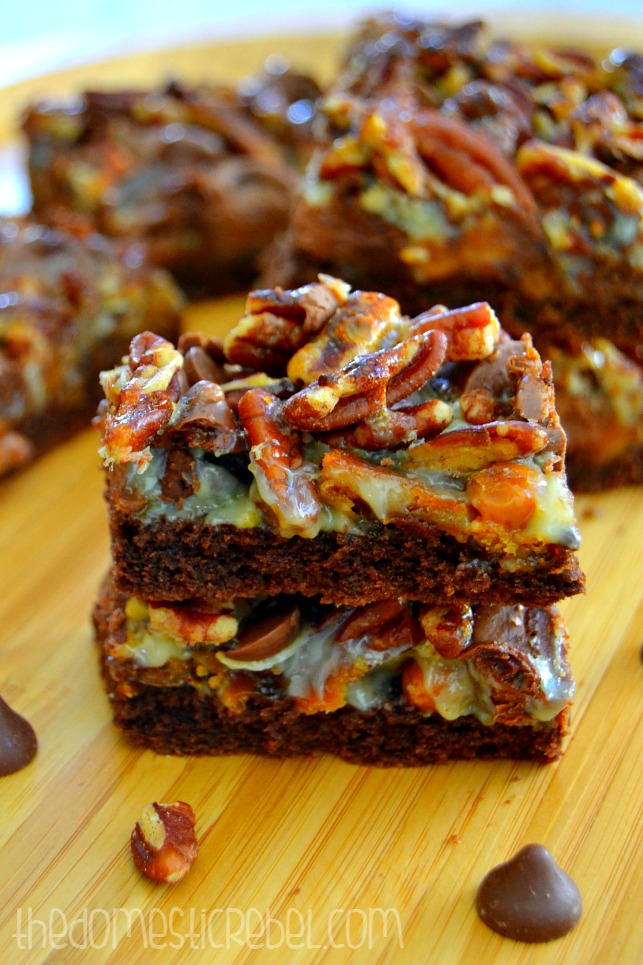 turtle seven layer bars stacked on a wood board
