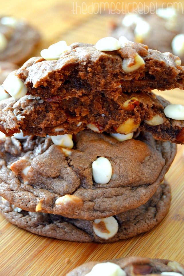 Nutella Hazelnut Chip Cookies stacked and showing interior of cookie on wood board