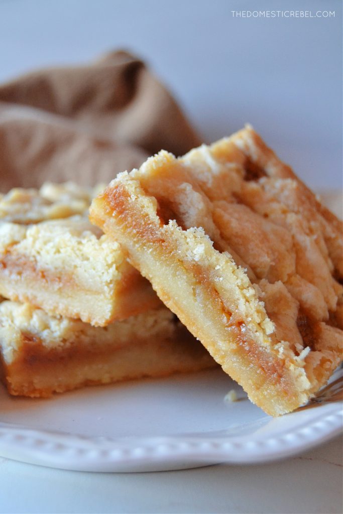 three salted caramel butter bars sit on a small white plate. 