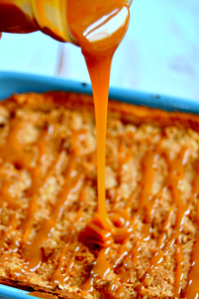 photo of caramel sauce being poured onto deep dish salted caramel apple pie