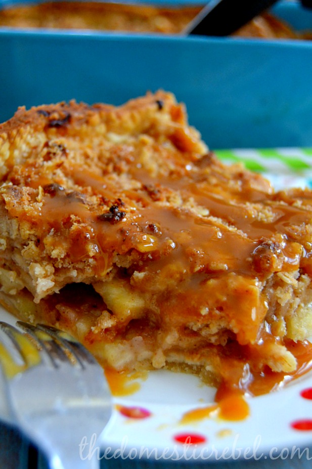 deep dish salted caramel apple pie closeup with fork on polka dot plate