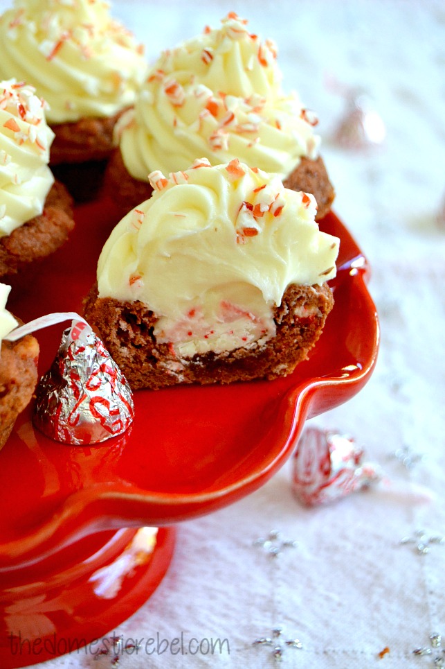 peppermint bark cheesecake cookie cups cut open on red cake stand