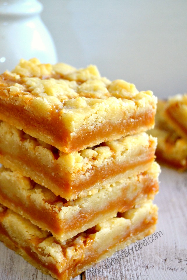 salted caramel butter bars stacked with white background