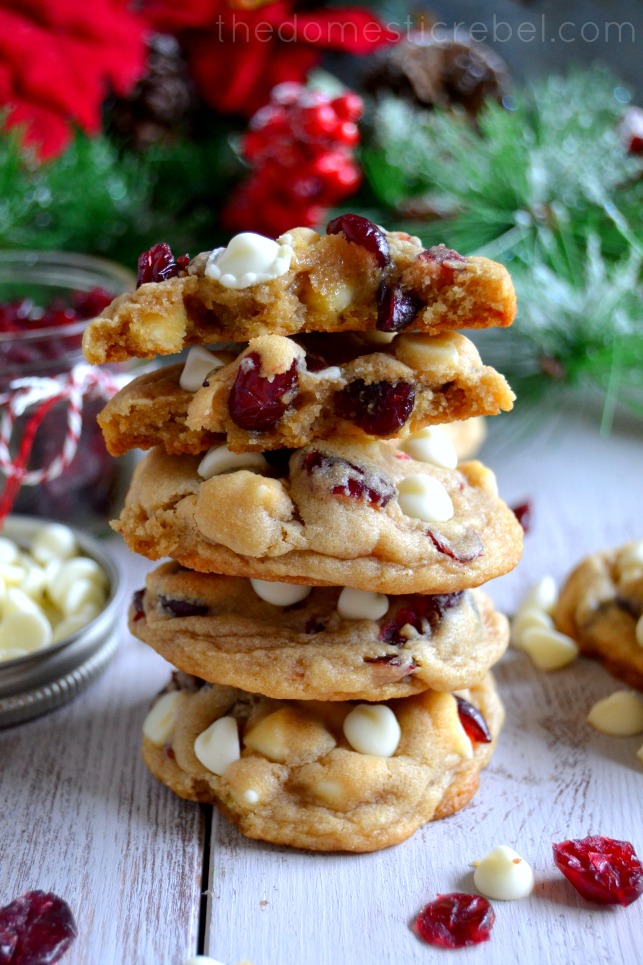 white chocolate cranberry cookies stacked on white background
