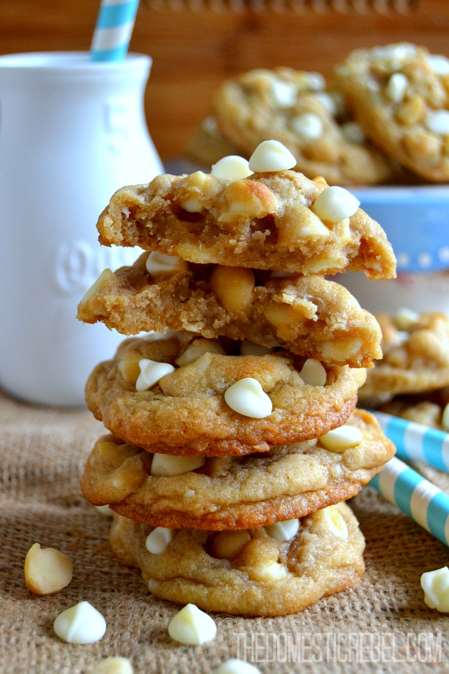 White Chip Macadamia Cookies stacked on burlap fabric