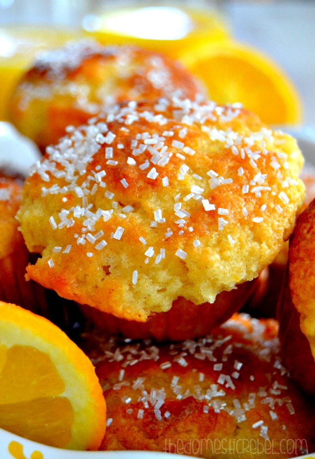 Sparkling Mimosa Muffins close-up with orange slices in background