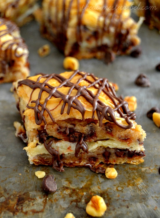 Chocolate Chip Cookie Dough Baklava piece on metal baking sheet with chocolate chips and nuts