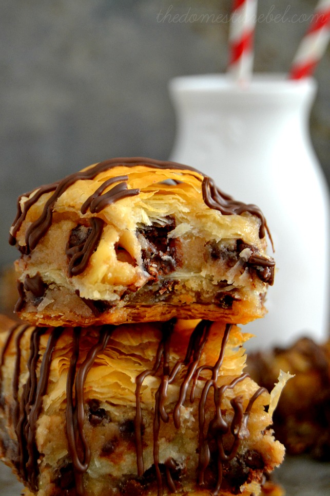 Chocolate Chip Cookie Dough Baklava close up with a bite removed and a bottle of milk in background