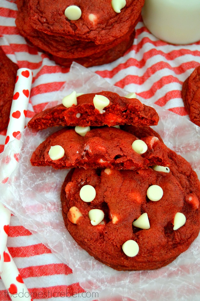 Red Velvet Cookies stacked on red and white background