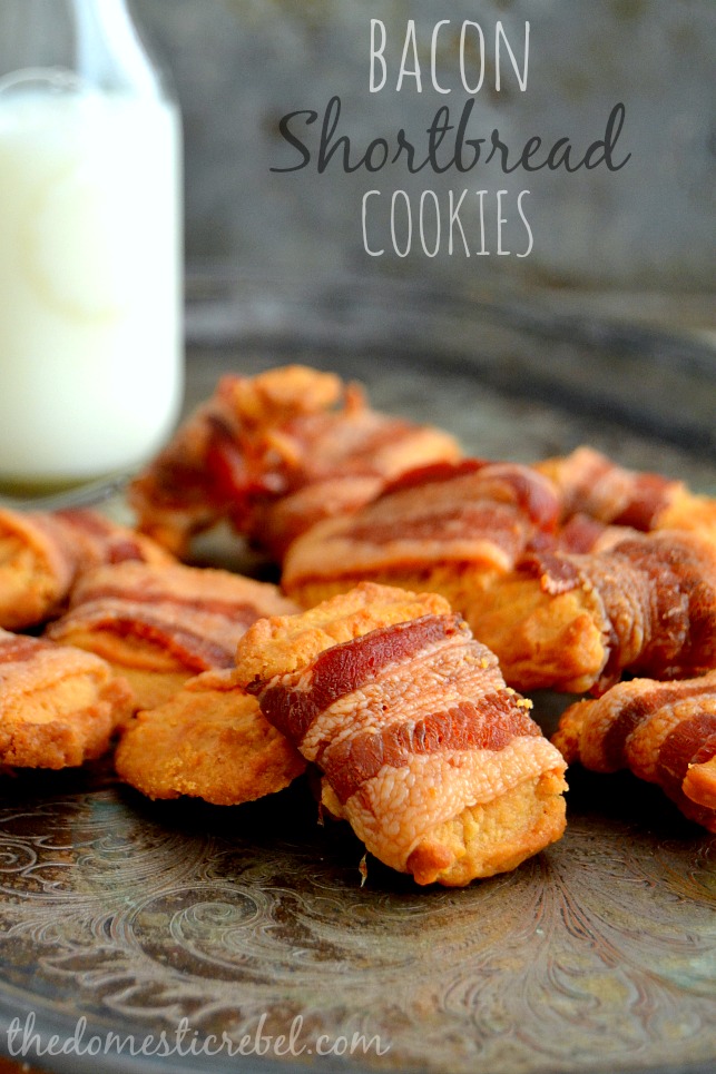 Bacon Shortbread Cookies arranged on metal sheet with glass of milk in background