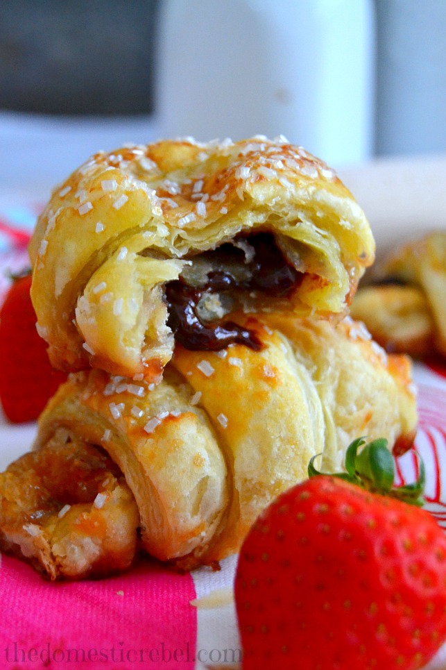 Strawberry & Nutella Croissants close up to show inside with strawberries in background