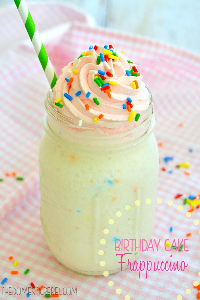 birthday cake frappuccino in glass with green straw on pink background