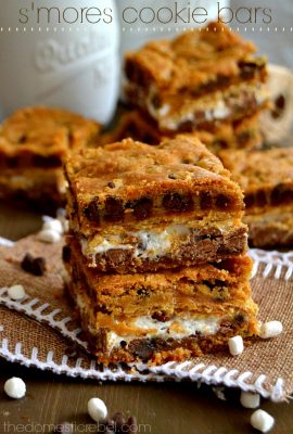 These S'mores Cookie Bars are gooey wonders! This easy, foolproof recipe produces supremely thick and chewy cookie bars bursting with chocolate and marshmallow!