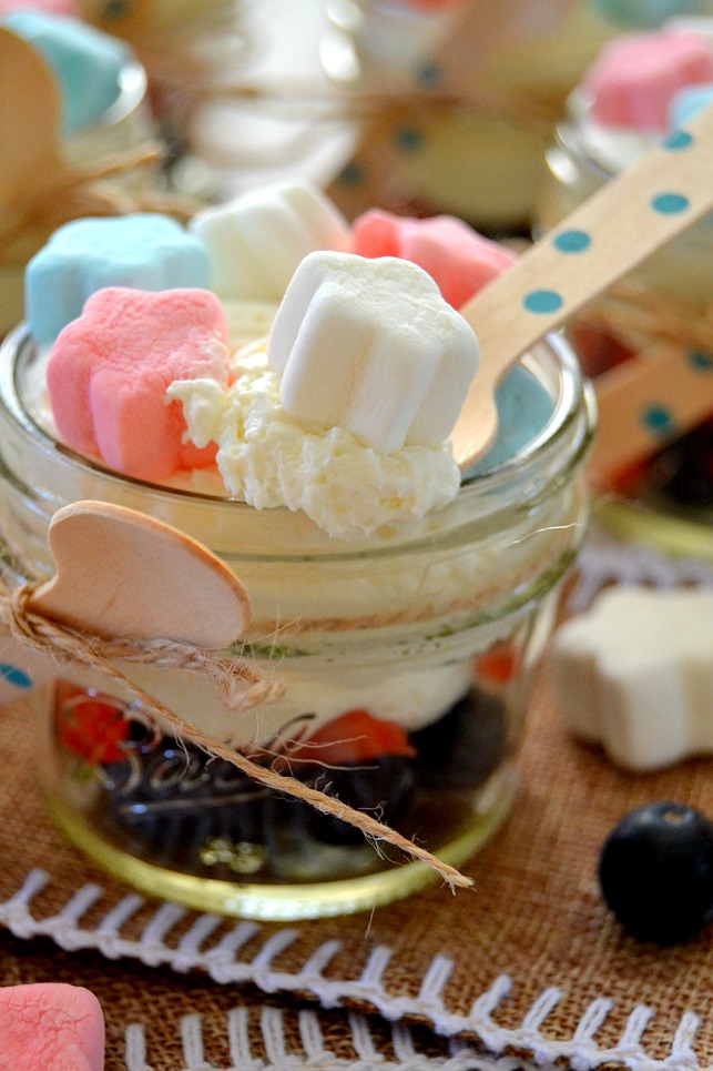 Patriotic Marshmallow Cheesecakes on a spoon with marshmallows