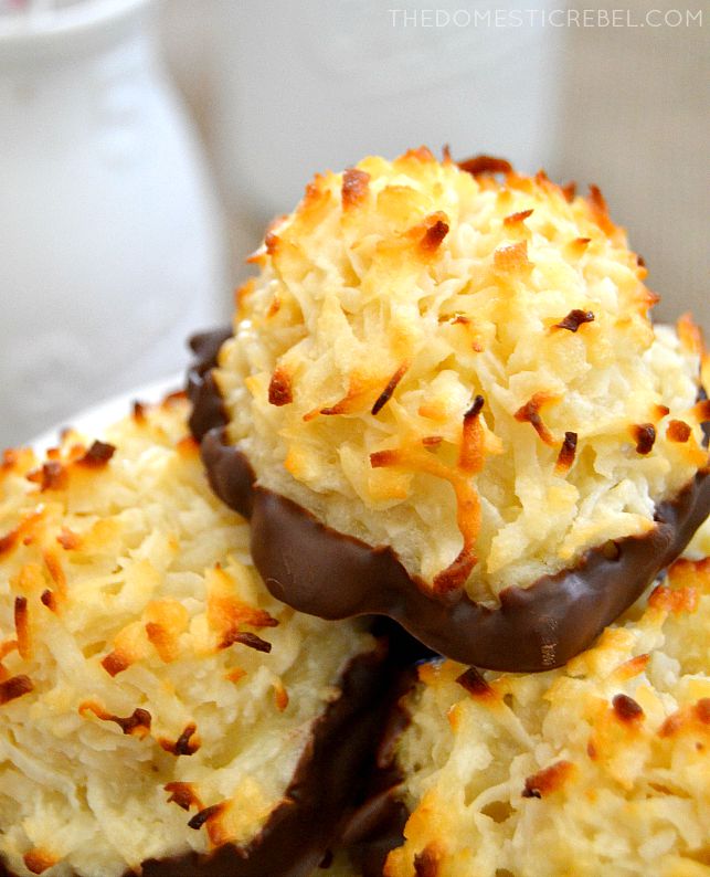 Coconut Macaroons stacked with white dishes in background