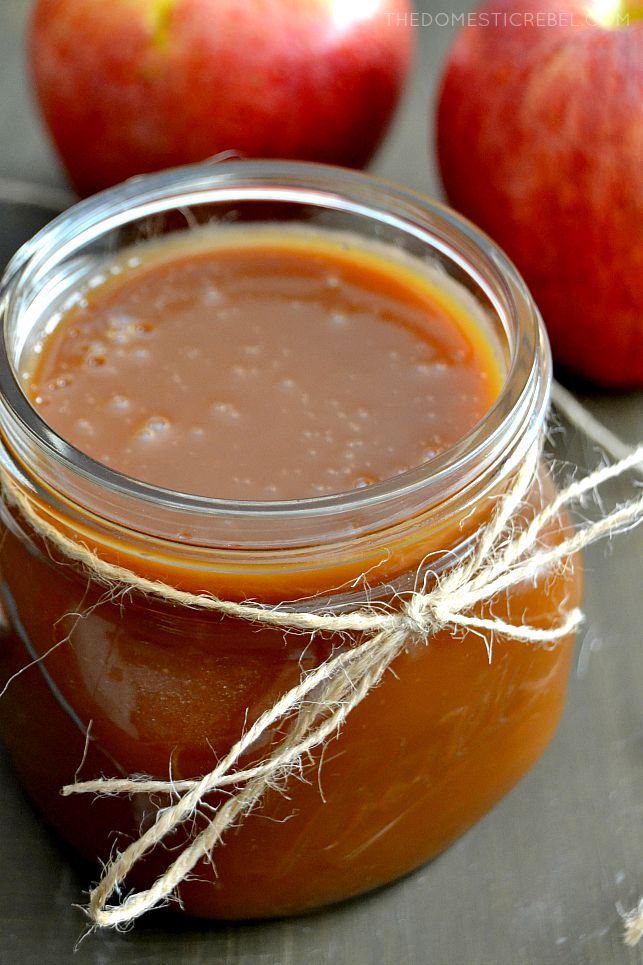 Salted Caramel Sauce in jar tied with twine with apples in background