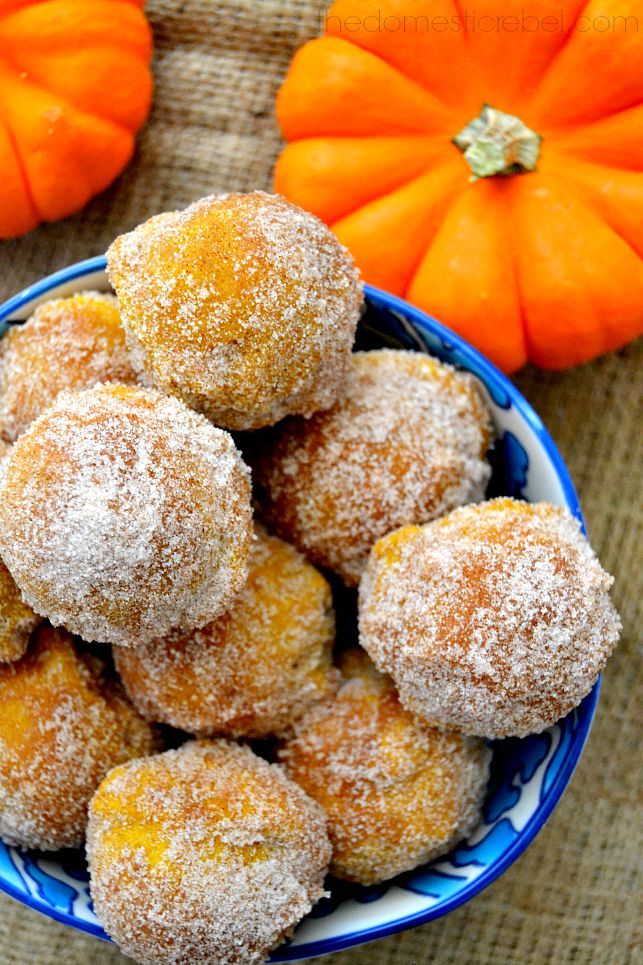maple pumpkin donut holes in blue bowl on burlap with pumpkins