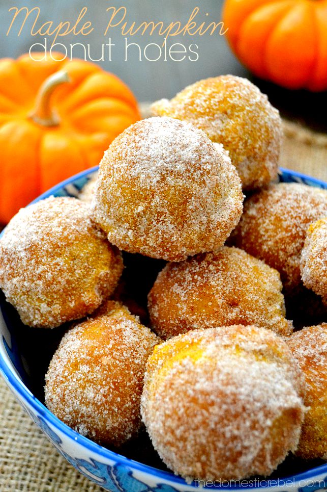 maple pumpkin donut holes in blue bowl with pumpkins in background