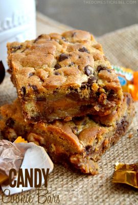 These Candy Cookie Bars couldn't be easier to whip up! Chewy chocolate chunk cookies are sandwiched between gooey chopped candy bars in these delightful, foolproof cookie bars!