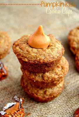 These Pumpkin Kiss Cookie Cups are so simple and foolproof! Simply bake up oatmeal cookies in muffin tins and pop in a Hershey's Pumpkin Spice Kiss for a delectable seasonal treat!