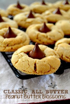 These classic, all-butter Peanut Butter Blossoms are the PERFECT cookie! Soft, chewy, thick and buttery and filled with a delectable chocolate center. This dough is so foolproof and doesn't require chilling!