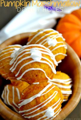 These Pumpkin Marshmallow Donut Holes are so fun! Moist, tender donut holes are filled with sweet marshmallow creme and topped with ribbons of white chocolate. The best seasonal treat guaranteed!