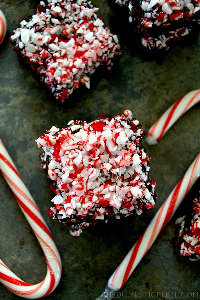 peppermint mocha brownies arranged on baking sheet with candy canes