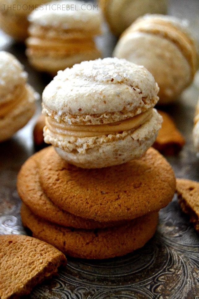 gingerbread macaron on stack of cookies on metal tray