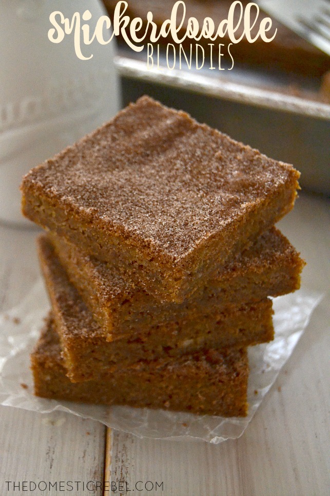 Snickerdoodle Blondies stacked on parchment and wood