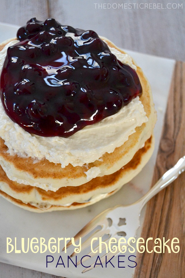 Blueberry Cheesecake Pancakes stacked on cutting board with fork