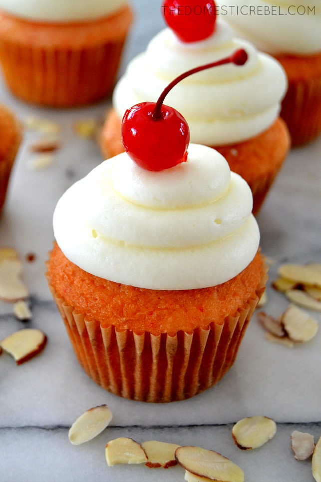 Cherry Almond Cupcake on marble slab with slivered almonds